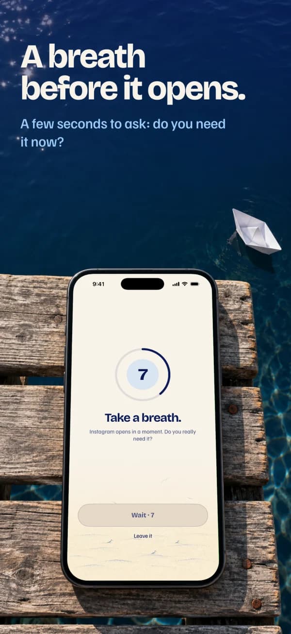 A breath before it opens. The phone on a wooden pier over the sea; on screen, a seven-second countdown.